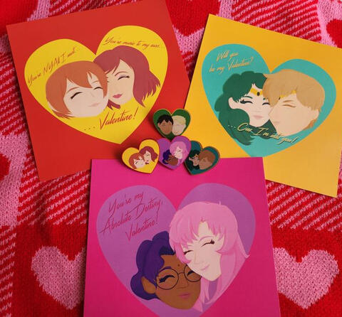 Valentines cards and wooden pins inspired by Love Live, Sailor Moon, Revolutionary Girl Utena, and Attack on Titan